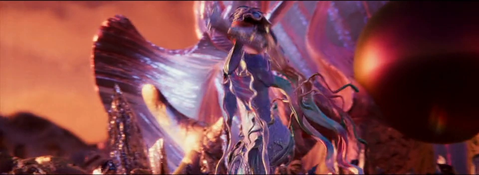 An iridescent figure rises beside pink folded forms and a dark sphere.