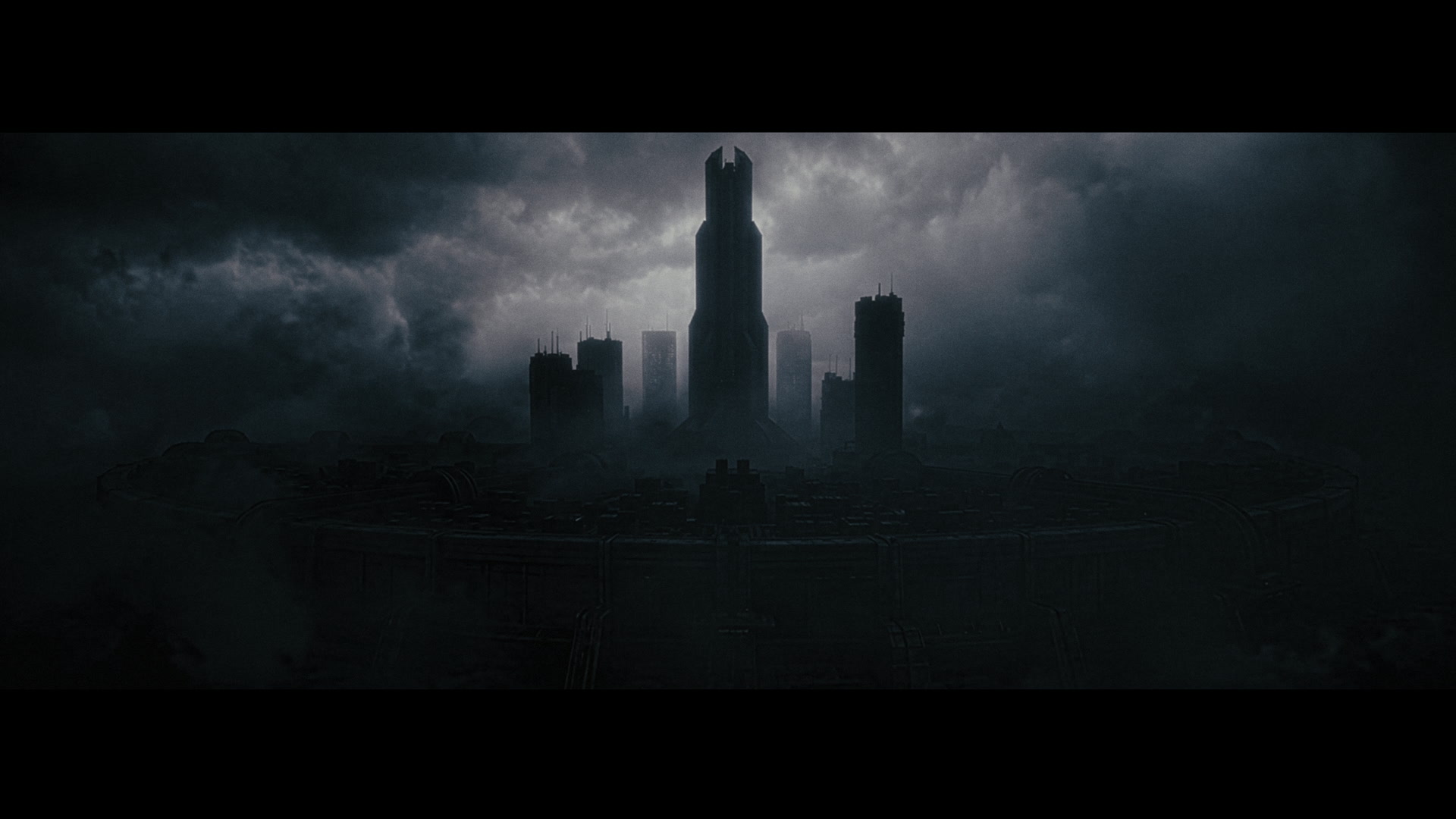 Tiger Hu — Dark futuristic tower against storm clouds