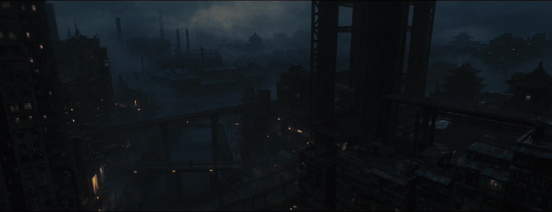 Dense rooftops, bridges and tall buildings recede into a stormy blue-gray skyline.