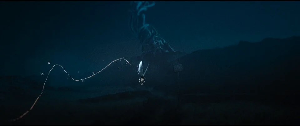 A luminous trail winds through the night.